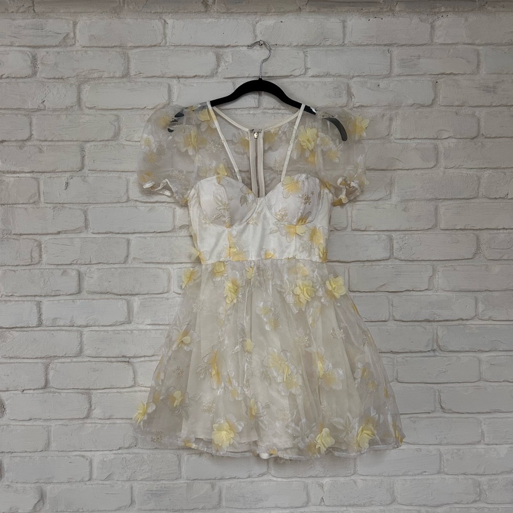 Light yellow dress with sheer back.